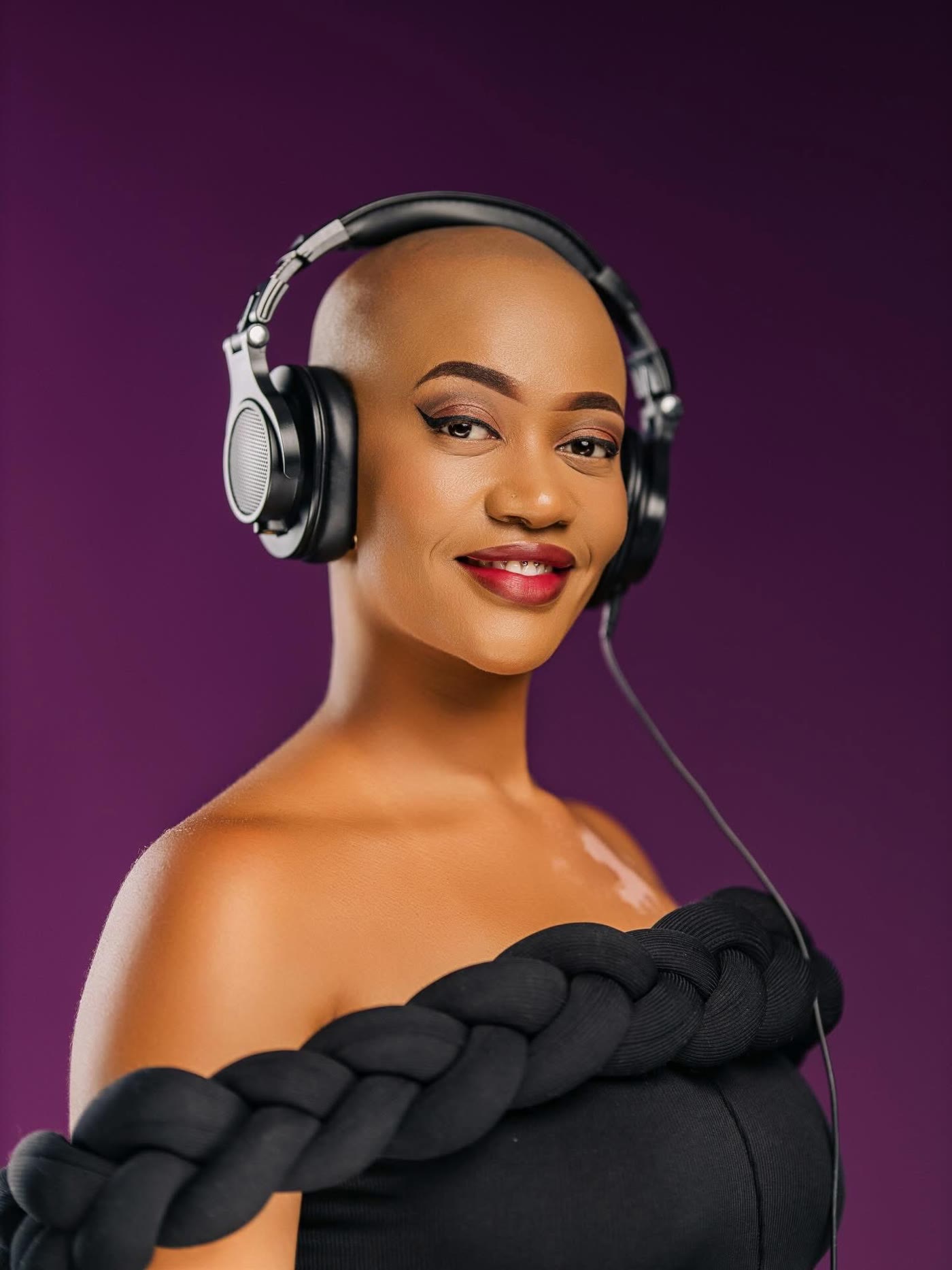Thee Leebow smiling with headphones on