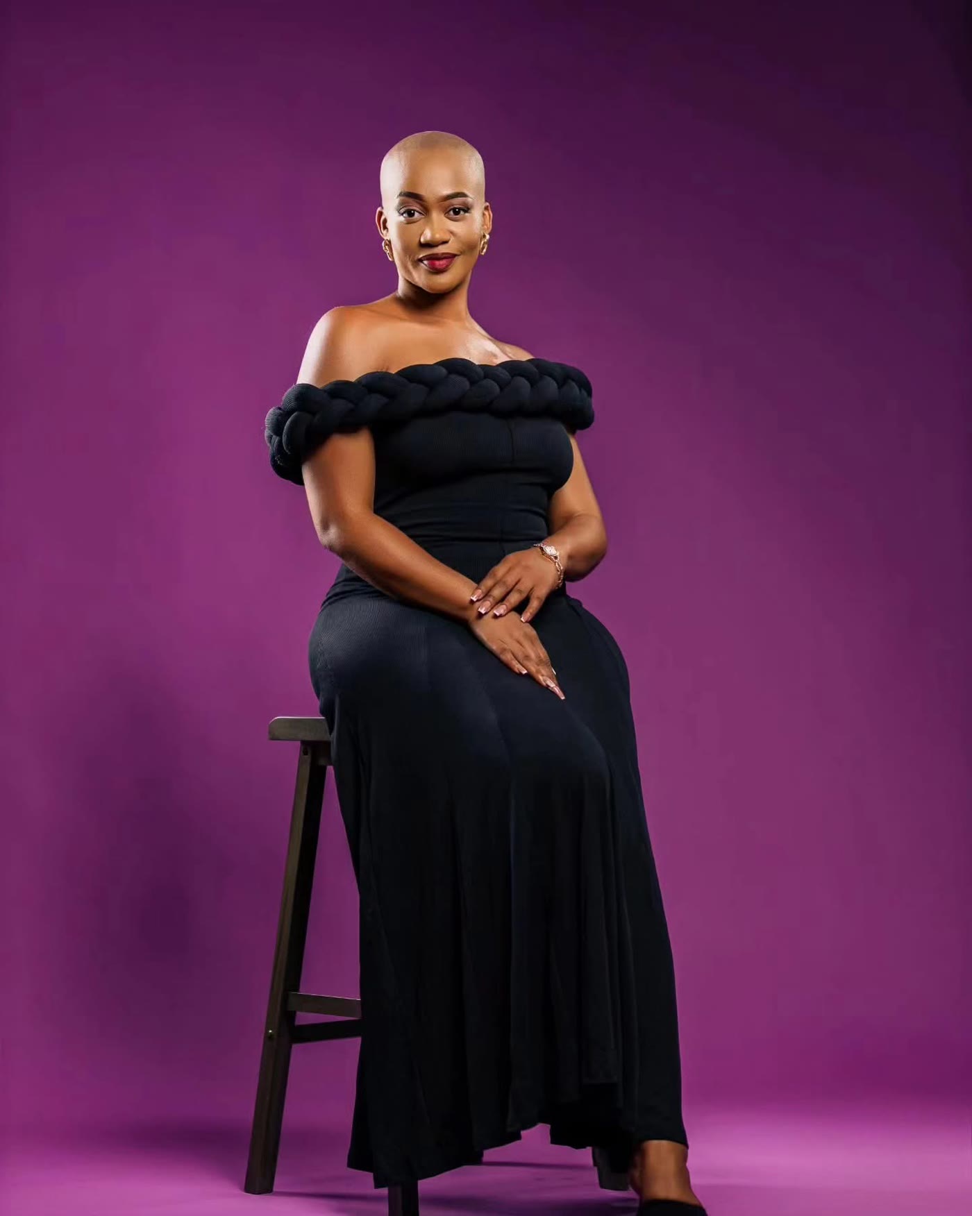 Thee Leebow seated in a black dress